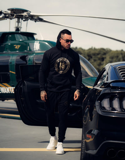 Conjunto moletom Mahe preto e dourado