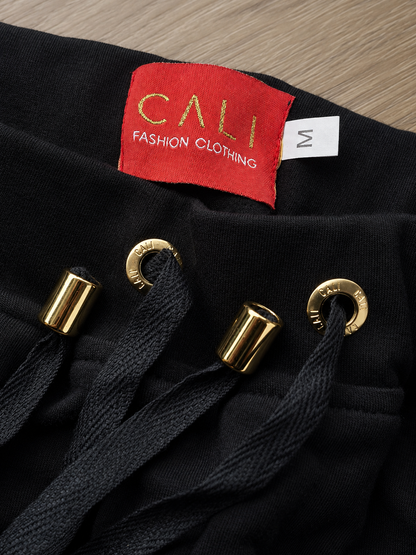 Calça Cali skinny preta com zíper dourado - foto 3 de 11